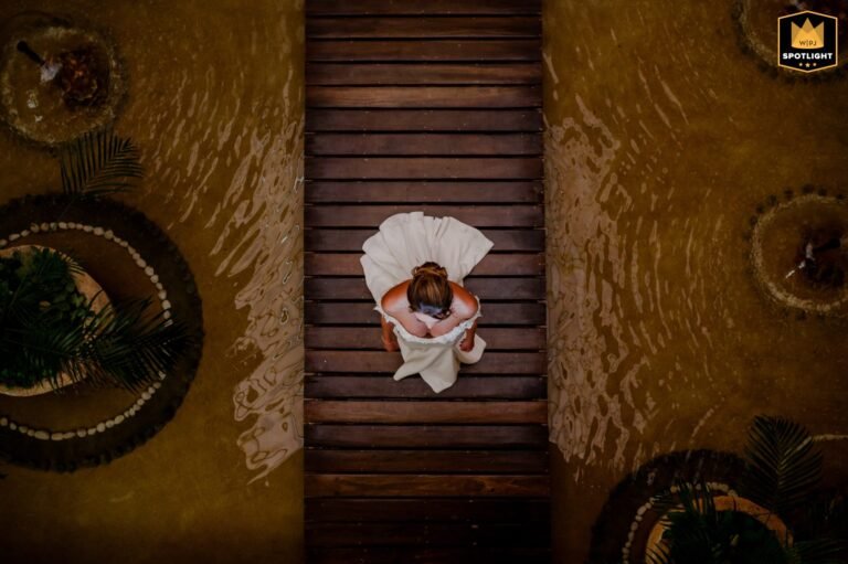 Bride seen from above on a wooden deck, WPJA Spotlight award-winning wedding photo